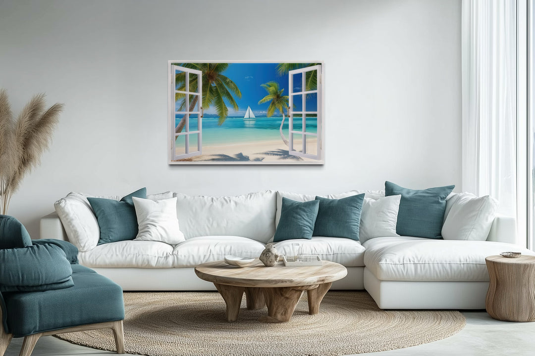 Caribbean beach and sailboat open window view wall art above a white sectional sofa.