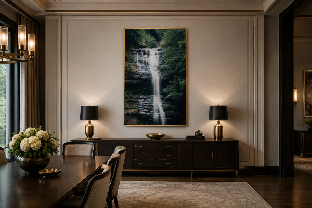 Vertical wall art of a sage green forest waterfall landscape hanging in a dining room.