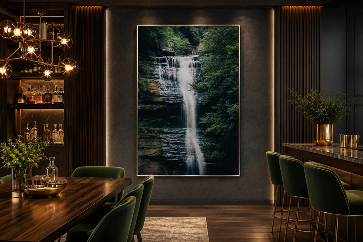 Vertical wall art of a sage green forest waterfall on a dark textured wall in a modern dining room.