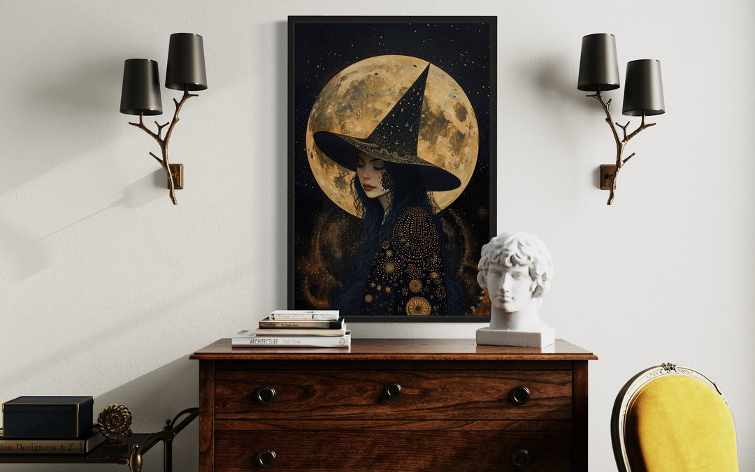 Celestial witch wall art with a full moon and starry sky, framed above a wooden dresser.