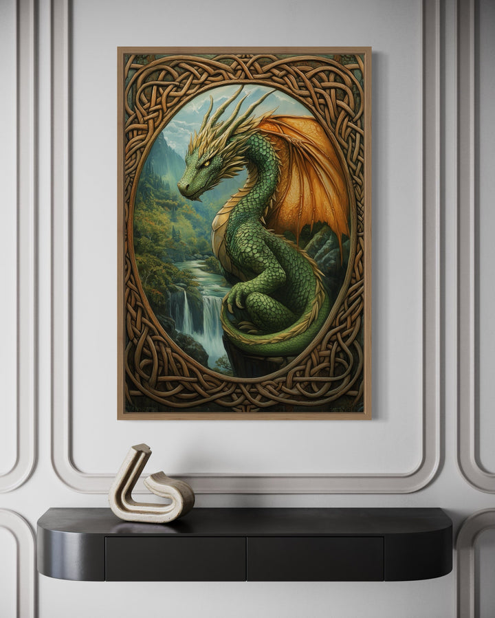 Framed canvas art of a green Celtic dragon perched over a waterfall in a mountain valley.