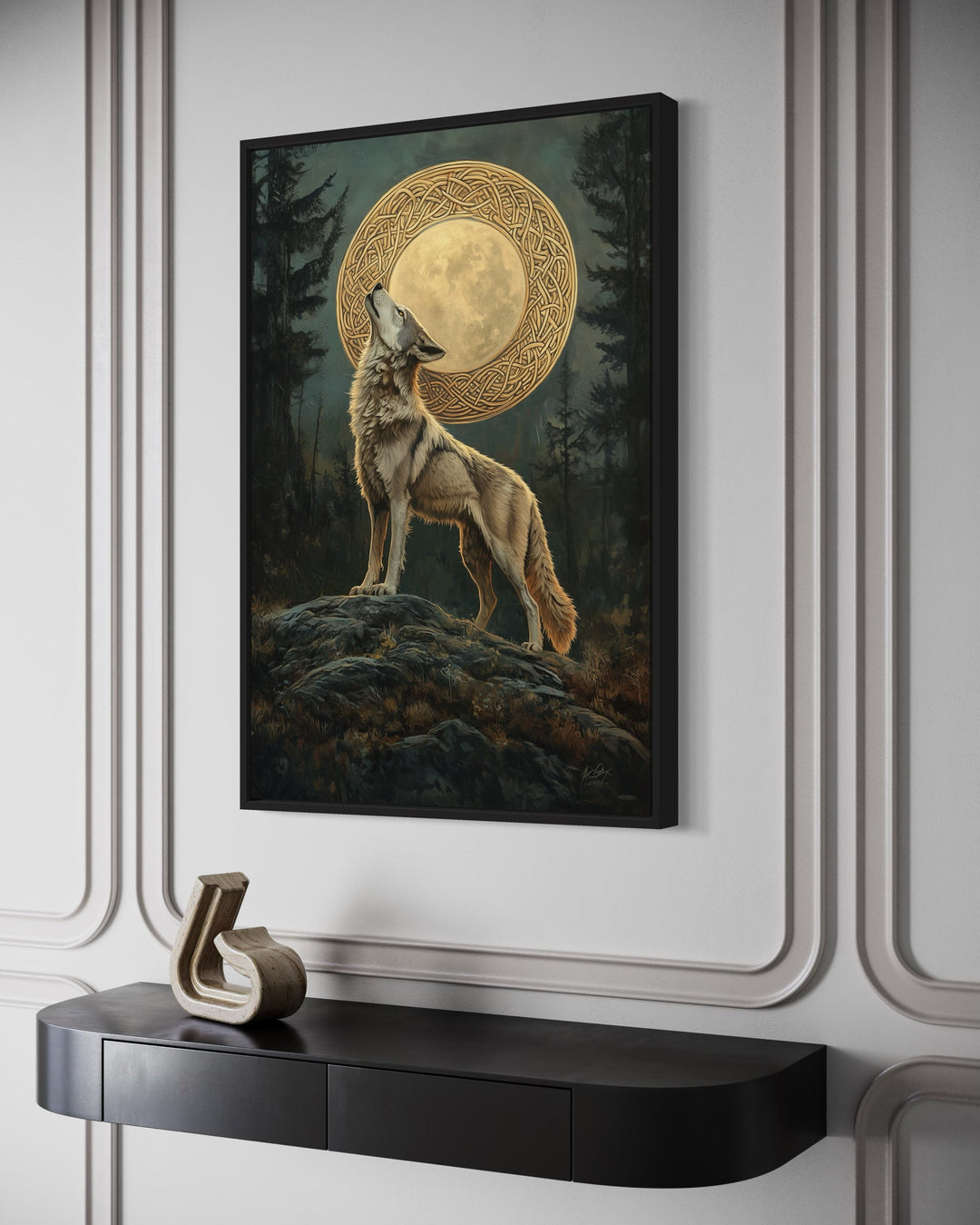 Celtic Wolf and Moon framed canvas wall art hanging above a black console table in a modern room.