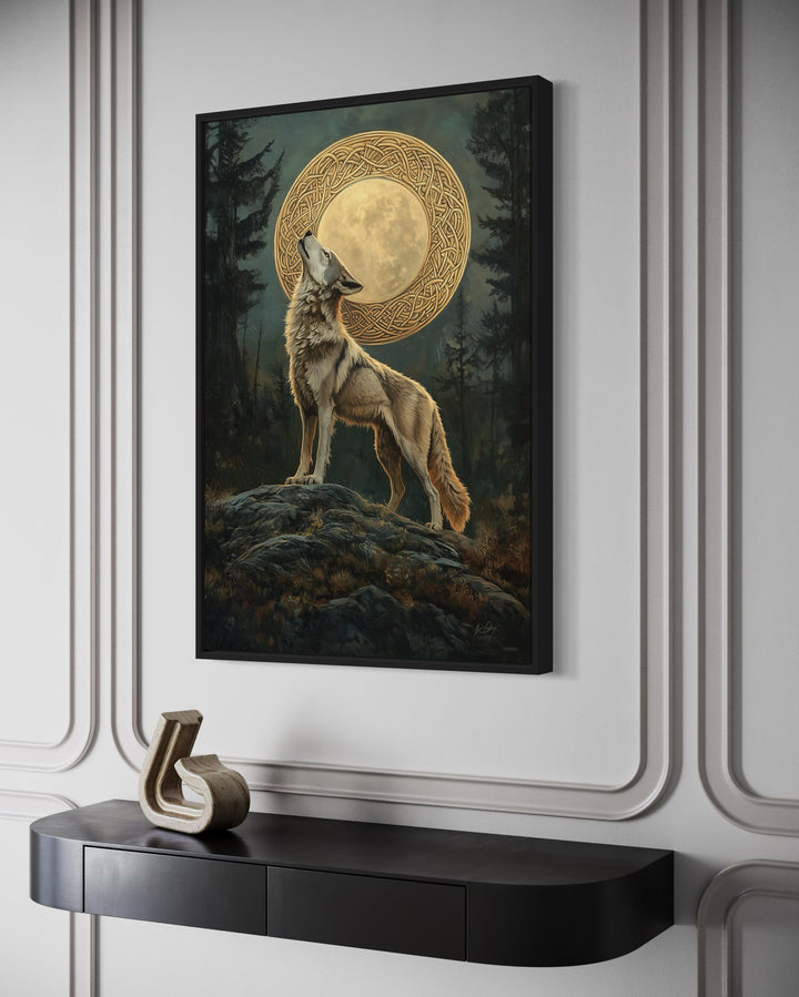 Celtic Wolf and Moon framed canvas wall art hanging above a black console table in a modern room.