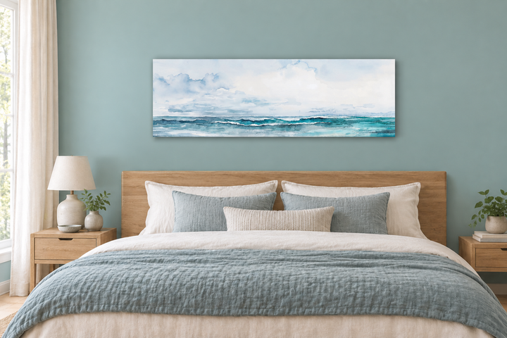 Minimalist ocean blue and gray horizontal framed canvas wall art hanging over a wooden bed frame.