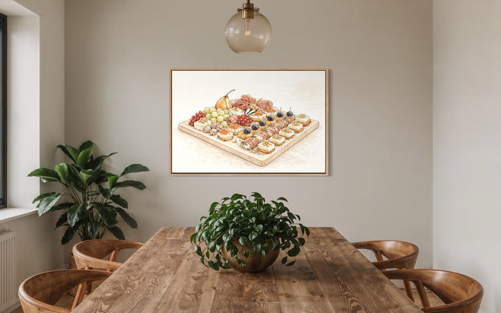 A framed canvas print of a charcuterie board hangs in a neutral-toned, modern dining room.