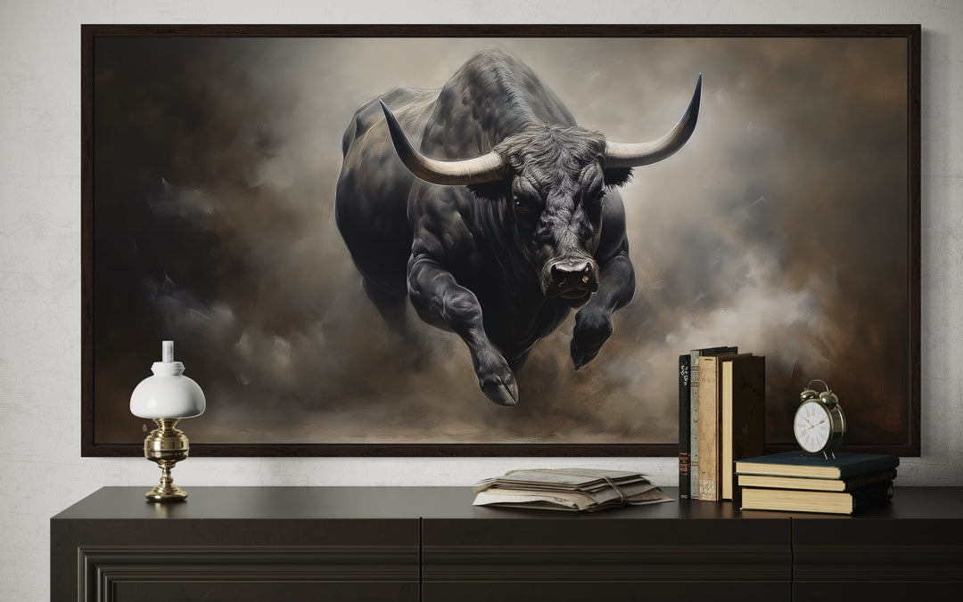 Framed canvas print of a powerful black charging bull in a rustic man cave setting.