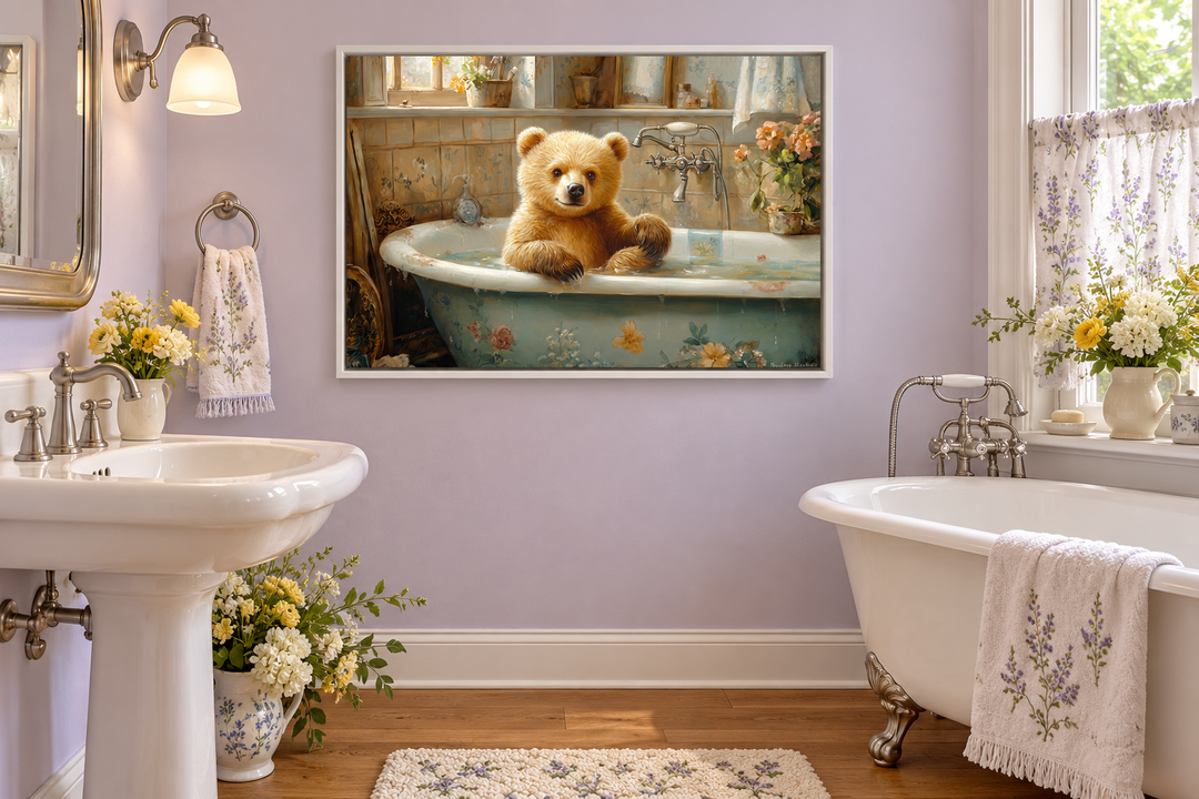 Baby bear in a vintage bathtub framed canvas wall art hanging in a lavender bathroom.