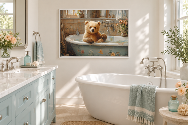 Baby Bear in a Bathtub Framed Canvas Wall Art hanging in a bright, modern bathroom.