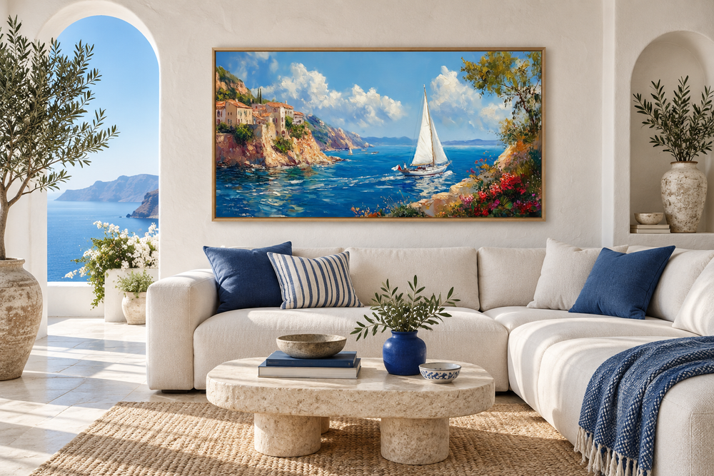 Amalfi Coast with Sail Boat Framed Canvas Wall Art hanging above a white sofa in a coastal room.