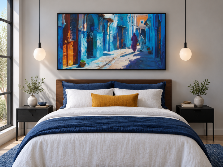 Chefchaouen Blue Street Painting Morocco framed canvas wall art hanging above a modern bed.