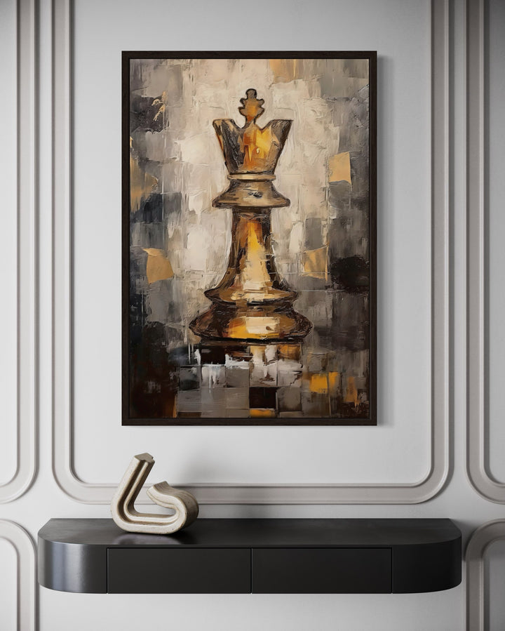 Abstract black and gold Chess King framed canvas wall art hanging above a black console table.
