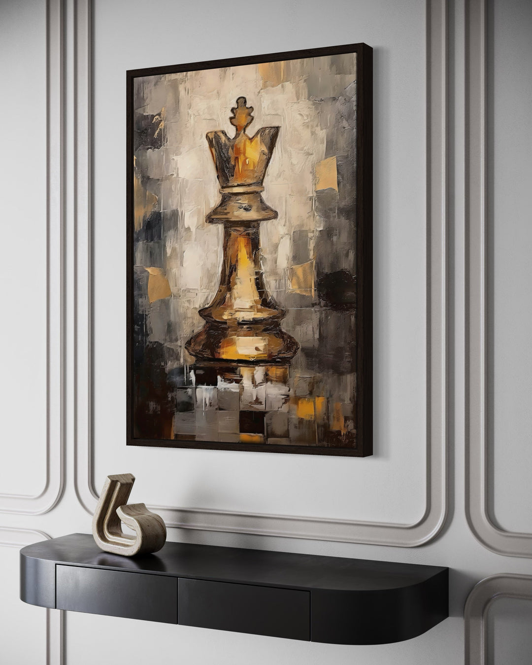Chess King framed canvas wall art in black and gold abstract style hanging above a black console.