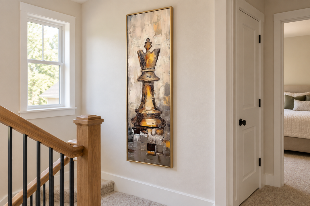Vertical slim canvas wall art of a golden chess king in a gold frame on a white wall.