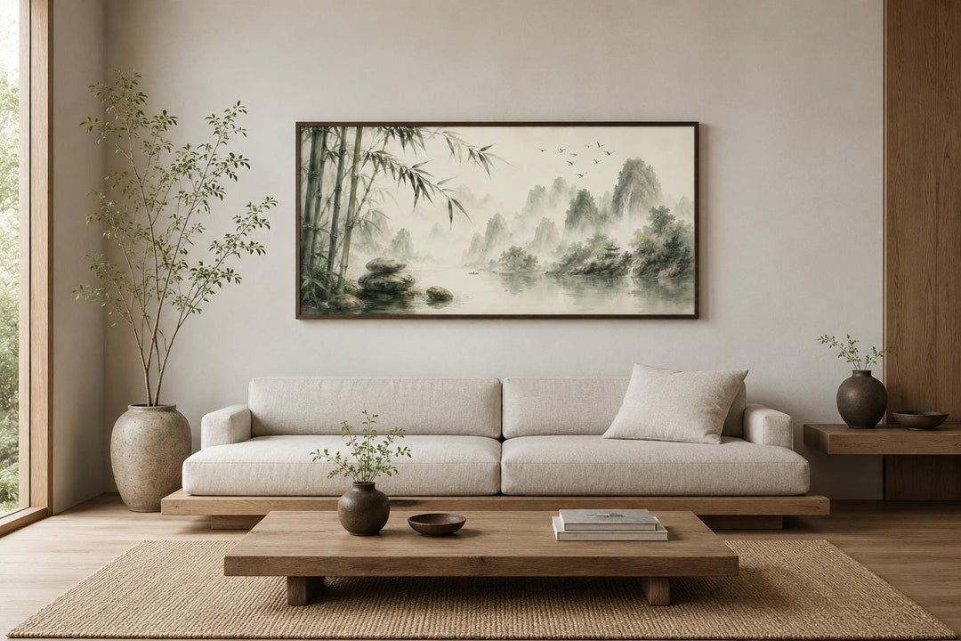 Chinese landscape canvas print featuring misty mountains and bamboo in a zen living room setting.