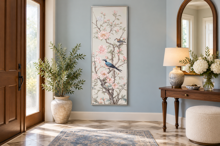 Tall narrow vertical Chinoiserie canvas print of birds on flowering branches in a blue entryway.