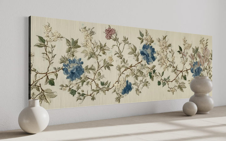 Long horizontal Chinoiserie wall art with blue and beige botanical flowers on a textured background.