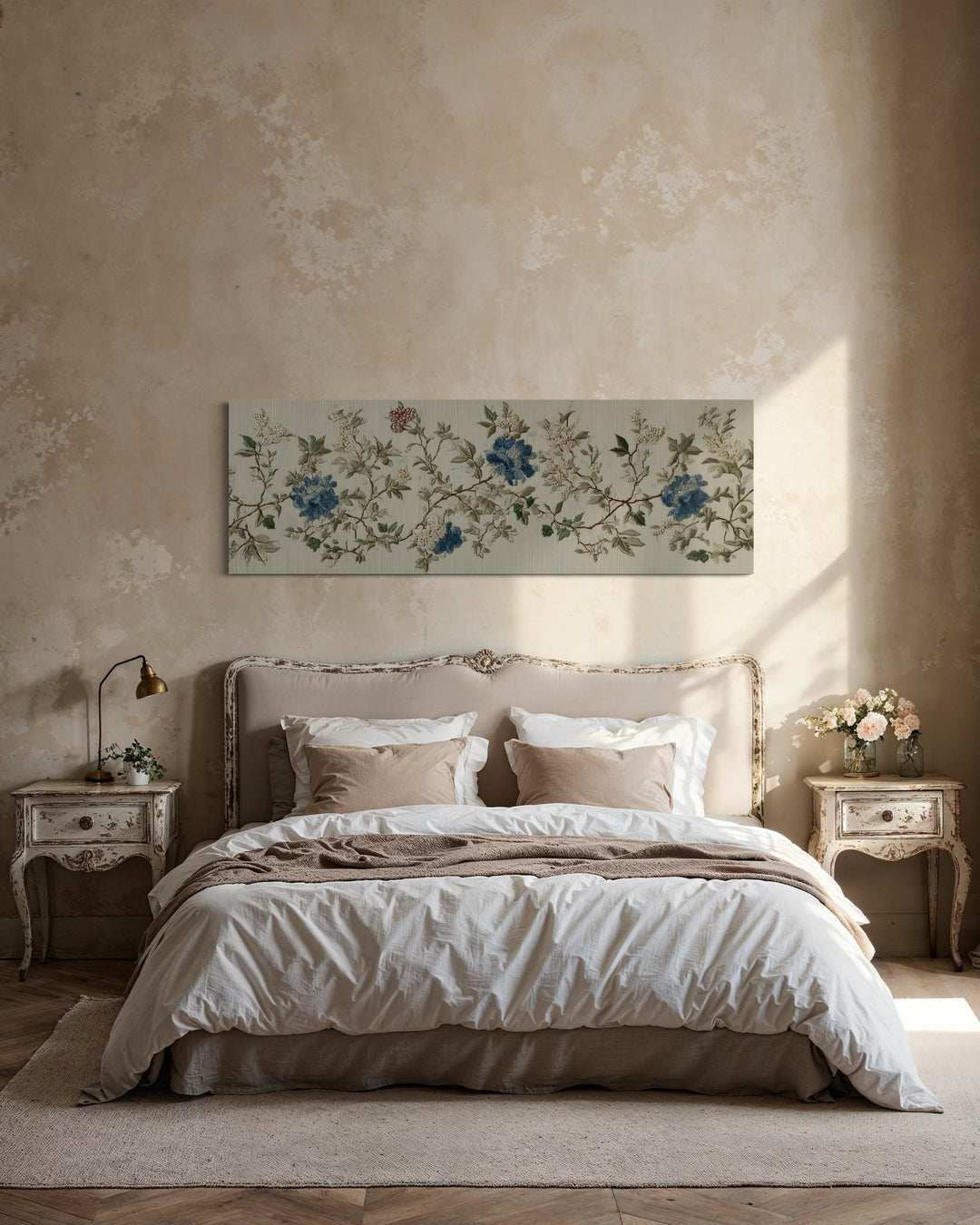 Long horizontal chinoiserie floral canvas wall art in blue and beige above a vintage-style bed.