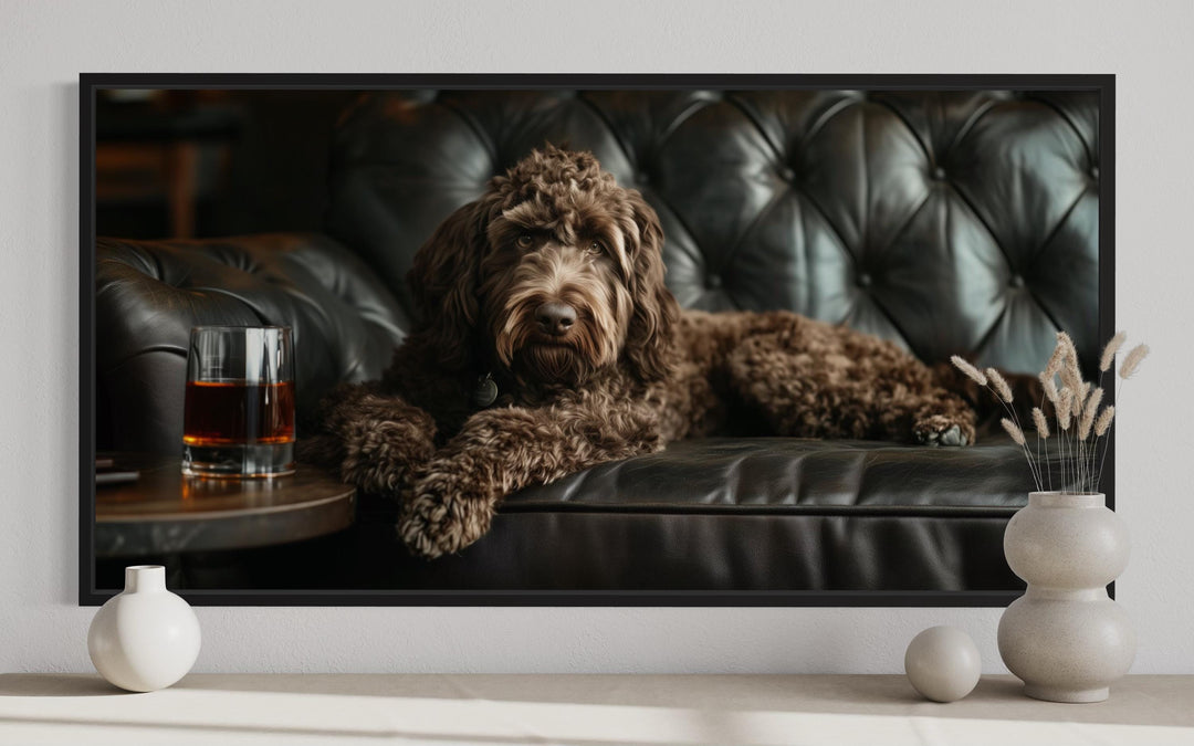 Chocolate Goldendoodle On Couch Drinking Whiskey Framed Canvas Wall Art