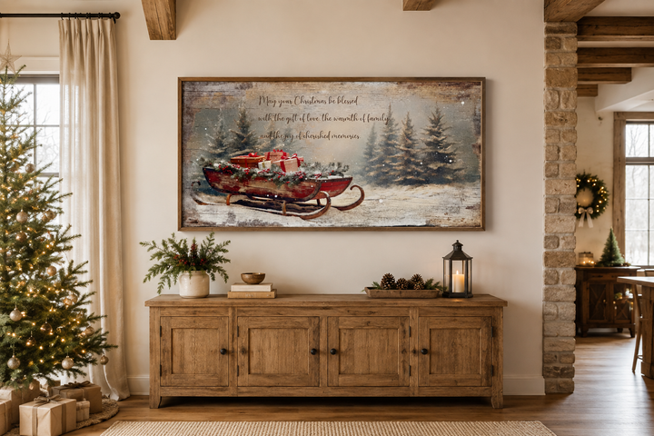 Framed canvas wall art of Santa's sleigh with gifts and a Christmas blessing in a rustic room.