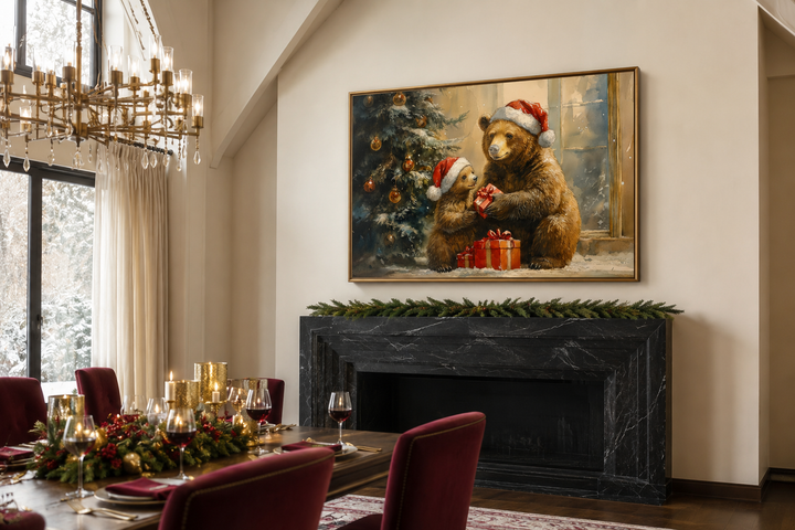 Mama bear and cub in Santa hats exchanging gifts on a framed canvas above a black marble fireplace.