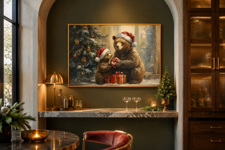 Framed wall art of a mama bear and cub in Santa hats exchanging gifts by a Christmas tree.