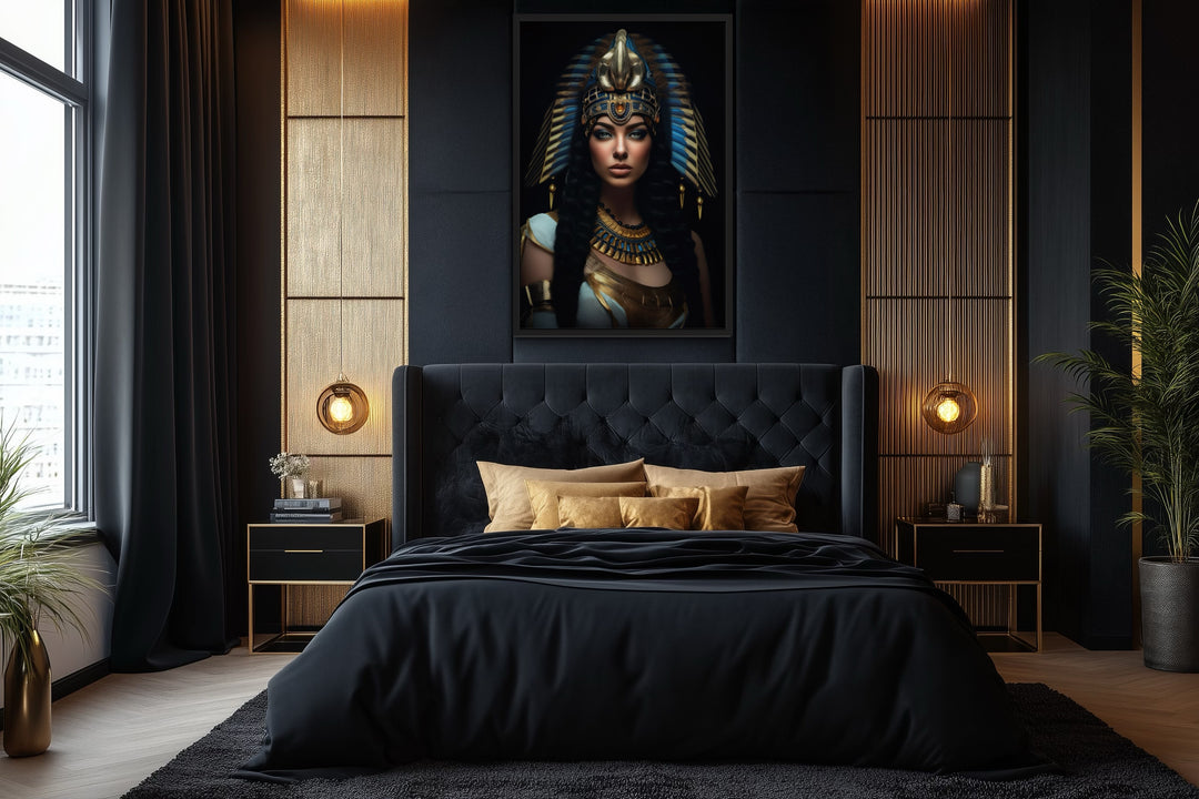 Cleopatra framed canvas wall art in a black and gold bedroom with a tufted headboard.