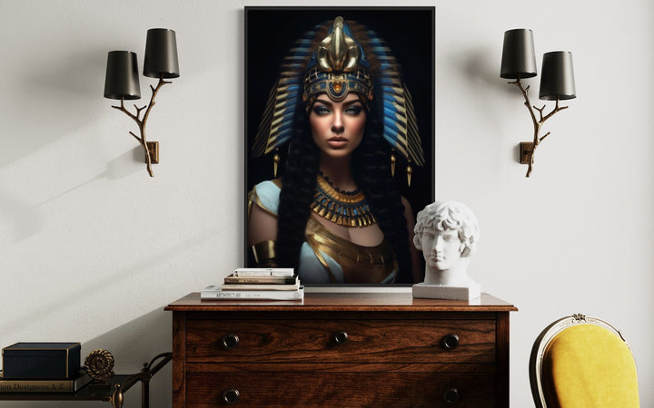 Cleopatra framed canvas wall art above a wooden dresser, flanked by two branch-style wall sconces.
