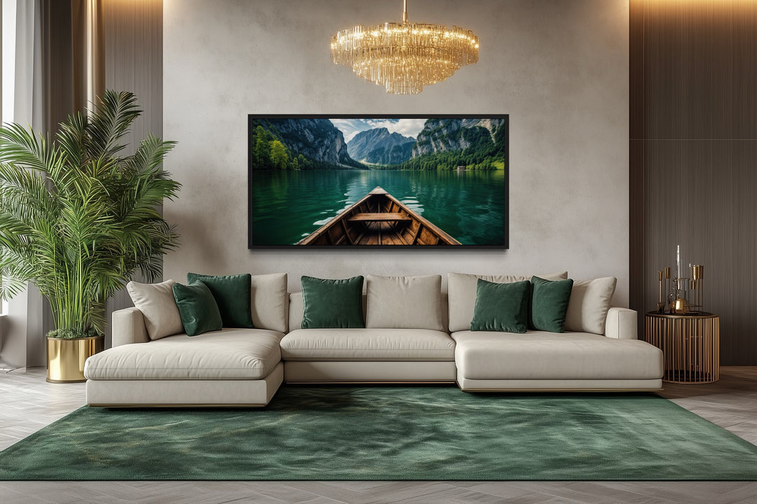 Framed canvas art of a wooden boat on an emerald green lake in a modern living room.