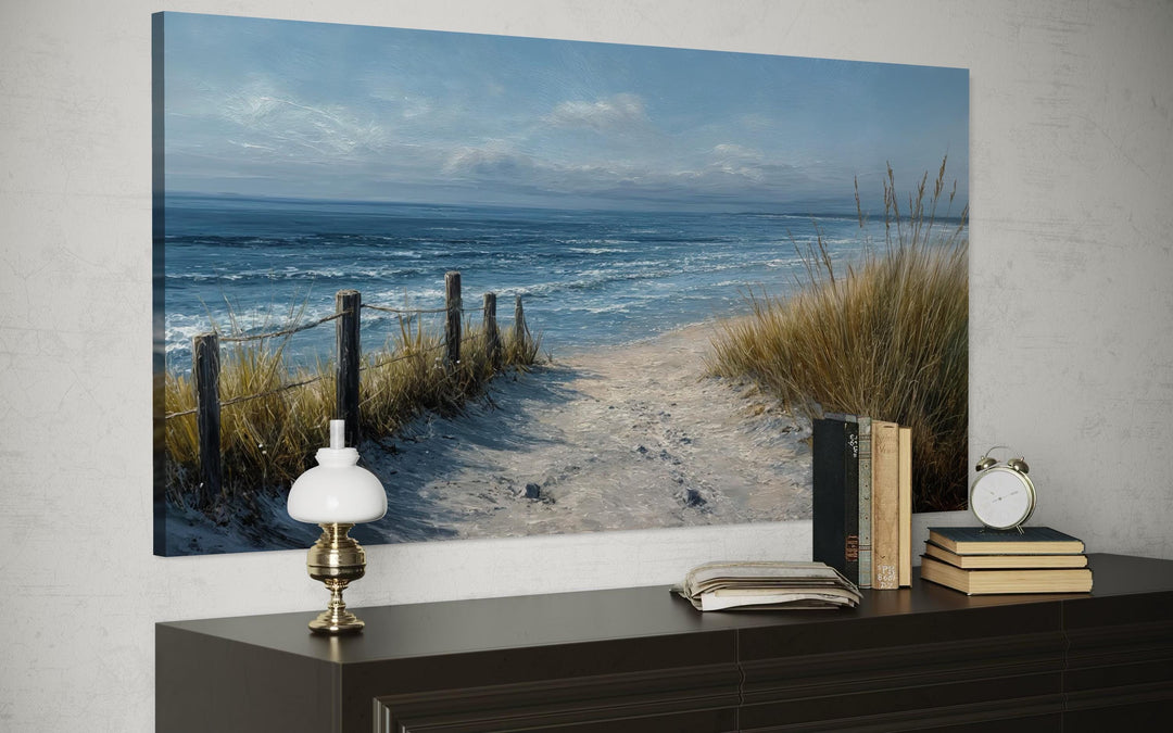 Horizontal canvas print of a serene beach path with dunes and ocean waves in blue and beige tones.