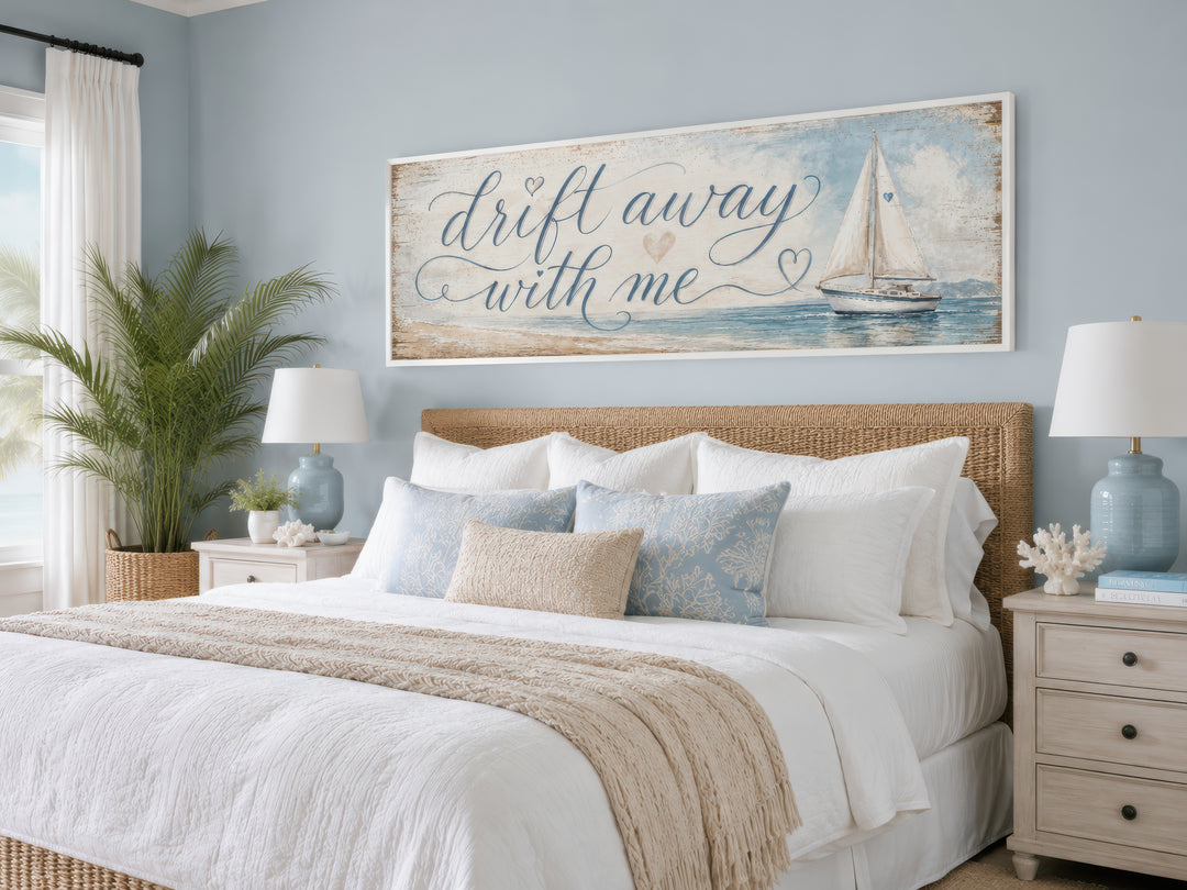 Coastal bedroom wall art with a sailboat and 'Drift Away With Me' text on light blue canvas.