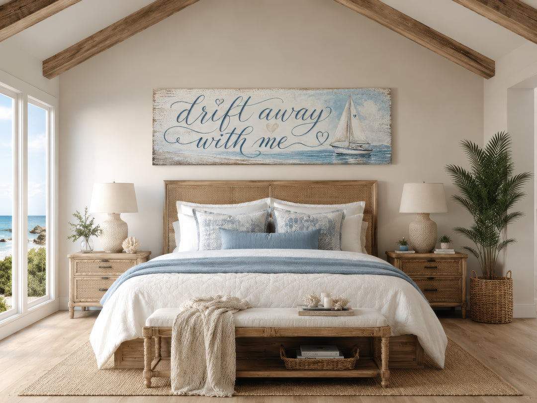 Coastal bedroom sign with sailboat on light blue canvas wall art above a bed in a nautical room.