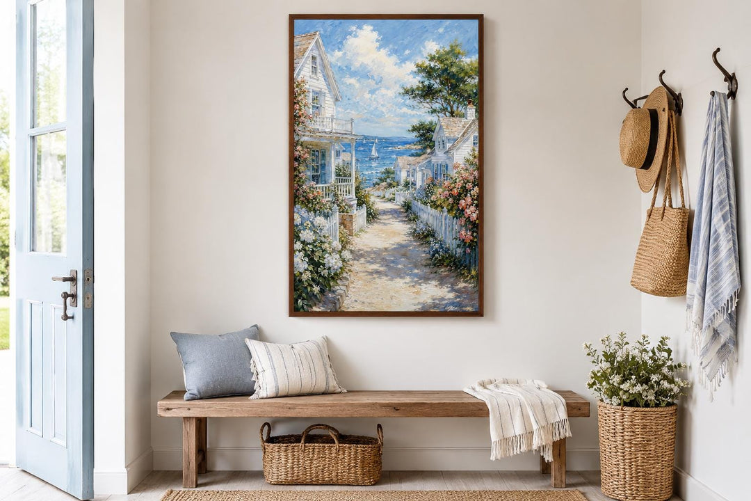 Vertical canvas print of a seaside path with white cottages and flowers leading to a blue ocean.