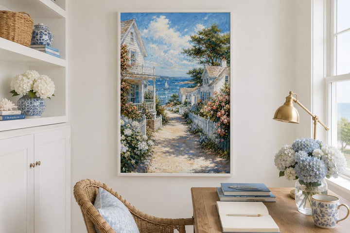 Vertical canvas print of a coastal cottage path leading to a blue sea with sailboats.