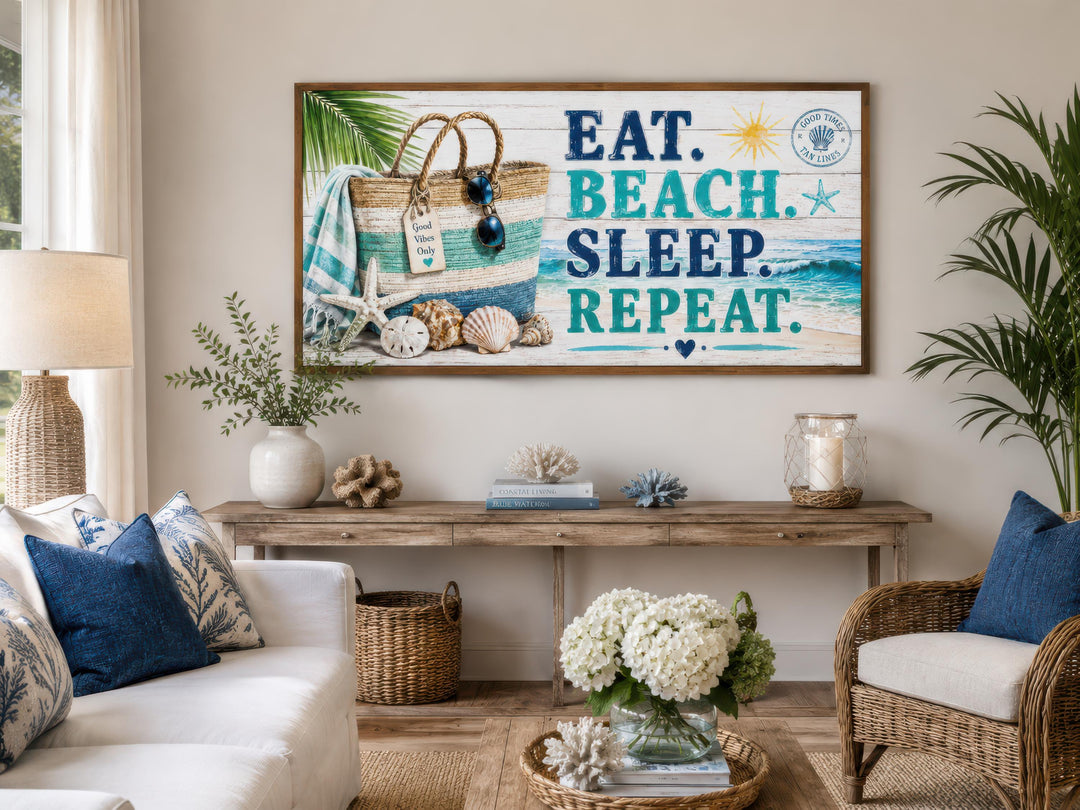 Coastal wall art with 'Eat Beach Sleep Repeat' text above a console table in a beach house setting.
