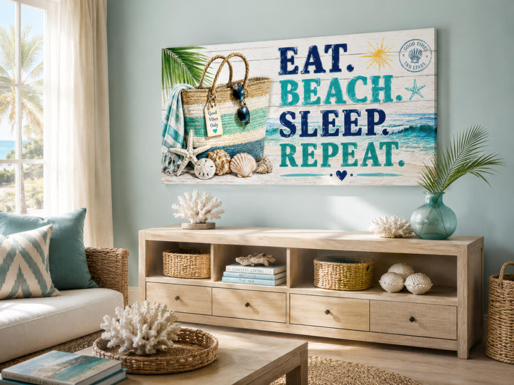 Coastal wall art canvas with "Eat. Beach. Sleep. Repeat." text above a wooden console table.