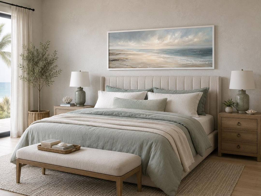 Long horizontal coastal wall art of a serene ocean seascape with soft clouds above a bed.