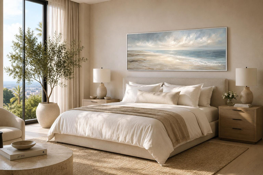 Long horizontal coastal wall art canvas featuring a soft ocean seascape above a neutral bed.
