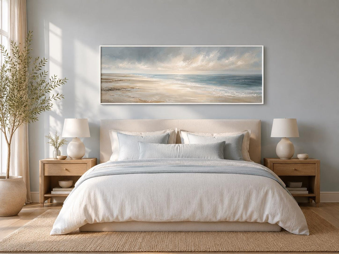 Long horizontal coastal wall art canvas featuring a soft ocean seascape above a neutral bed.