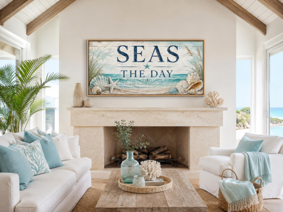 Seas the Day canvas wall art with starfish and seashells above a fireplace in a coastal living room.