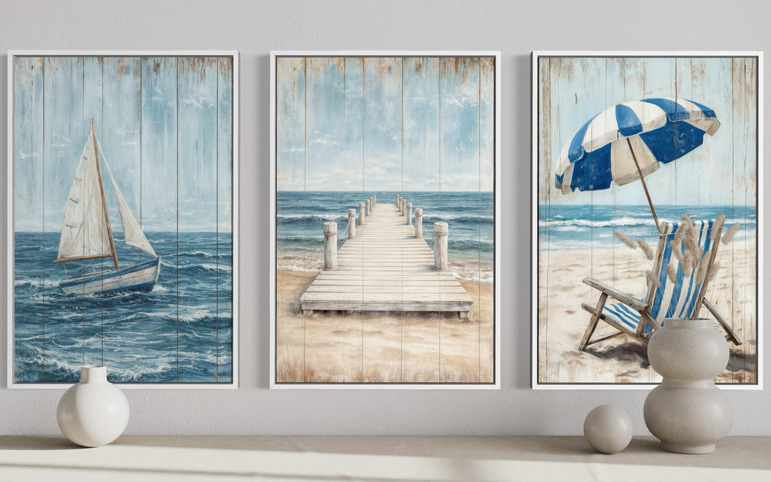 Three-piece coastal wall art set featuring a sailboat, a wooden pier, and a beach umbrella scene.