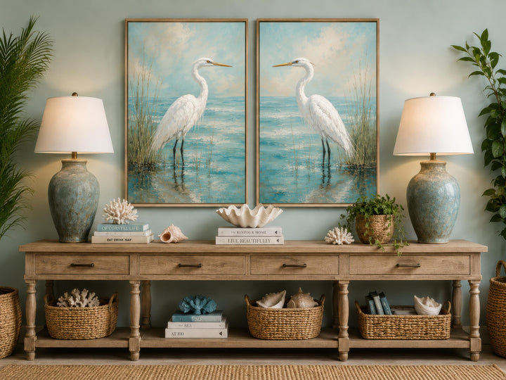 Set of two vertical canvas paintings featuring white egrets in a blue-teal coastal marsh.