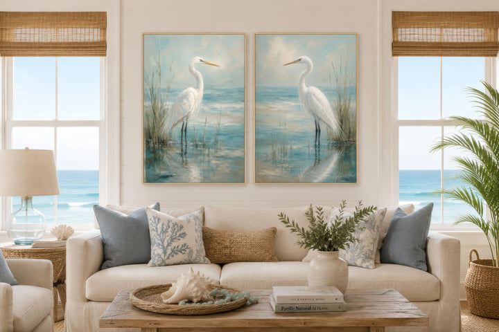 Set of two vertical canvas prints featuring white egrets in a blue-teal coastal marsh.