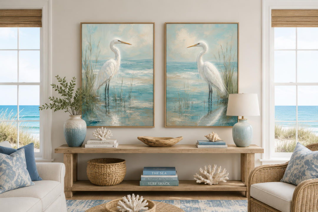 Set of two vertical canvas paintings featuring white egrets in a blue-teal coastal marsh.