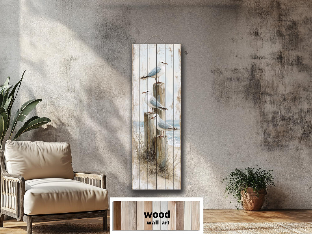 Tall narrow coastal wood wall art featuring seagulls perched on posts with a distressed finish.