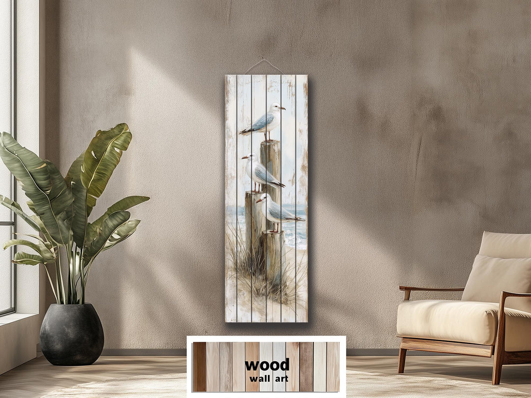 Coastal wood wall art featuring seagulls on posts with a distressed beach print on tall wood panels.