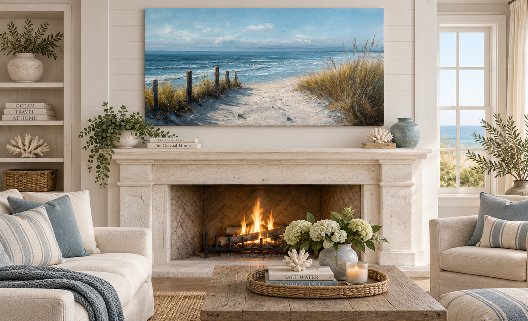 Horizontal coastal beach canvas print with a sandy path and blue ocean above a stone fireplace.