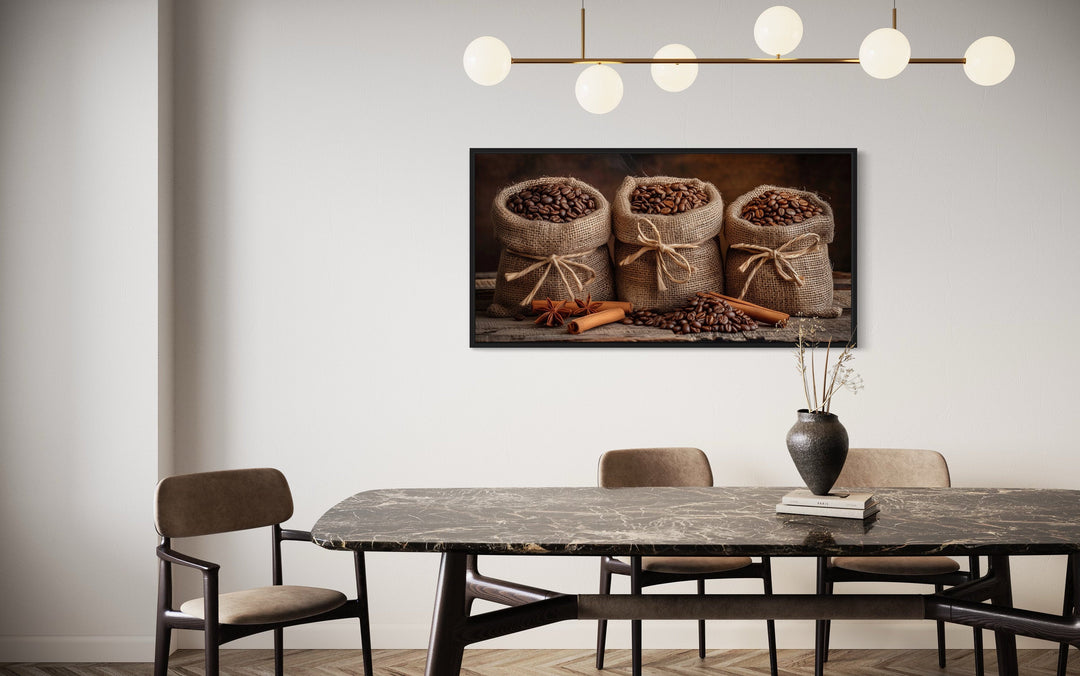 Framed canvas wall art of coffee beans in burlap bags and cinnamon sticks in a dining room.