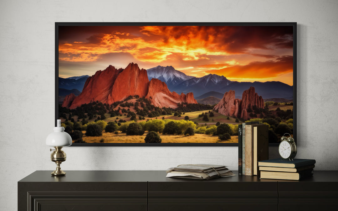 Colorado canvas wall art of Pikes Peak and Garden of the Gods at sunset above a dark wood dresser.