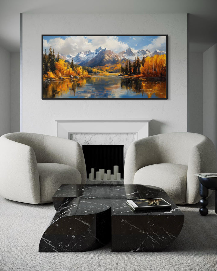 Colorado Rocky Mountains in Autumn framed canvas wall art above a fireplace in a modern living room.