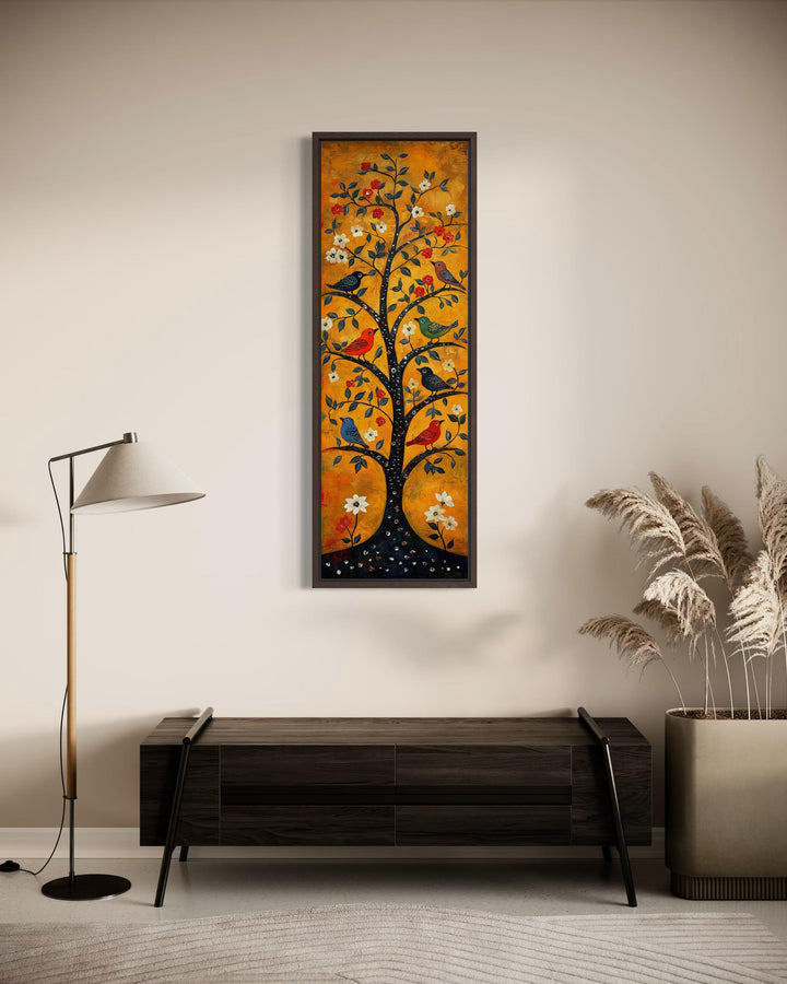Tall narrow vertical canvas print of a folk art tree with colorful birds on an orange background.